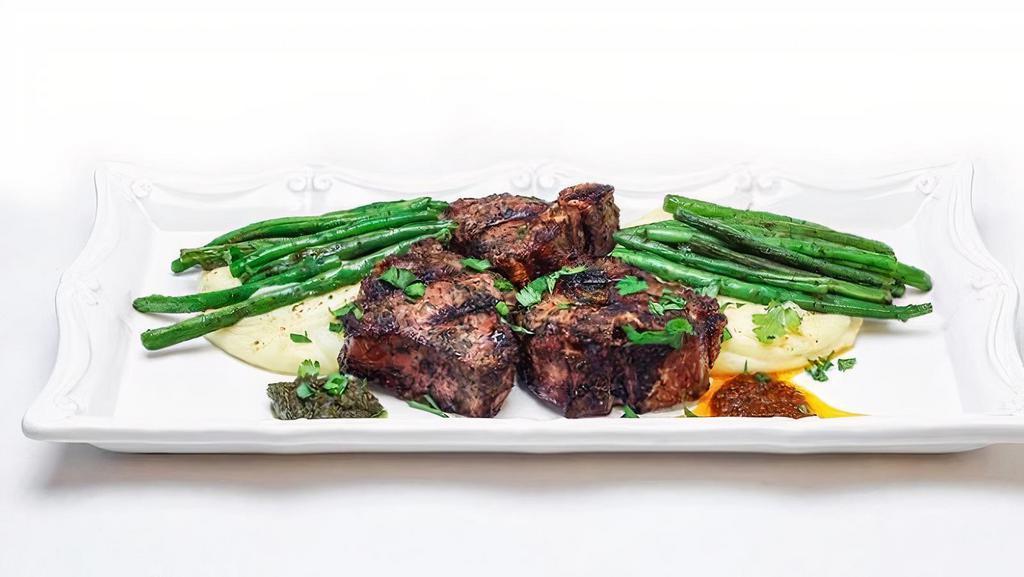 Mamatou'S Lamb · Gluten free. Medium. Azara's green sauce marinated grilled lamb loin chops served with garlic cheesy mashed potatoes, sautéed string beans with Azara's spicy BBQ sauce on the side.