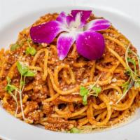 Yacouba'S Bolognese Pasta · Al dente cooked spaghetti coated in a thick hearty beef and lamb bolognese.