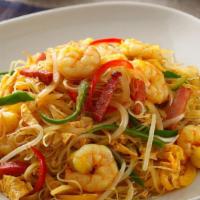 Singapore Mai Fun · Spicy. Thin Rice Noodle Stir-Fried with Shrimp, Ham, and Roast Pork in Curry Flavor.