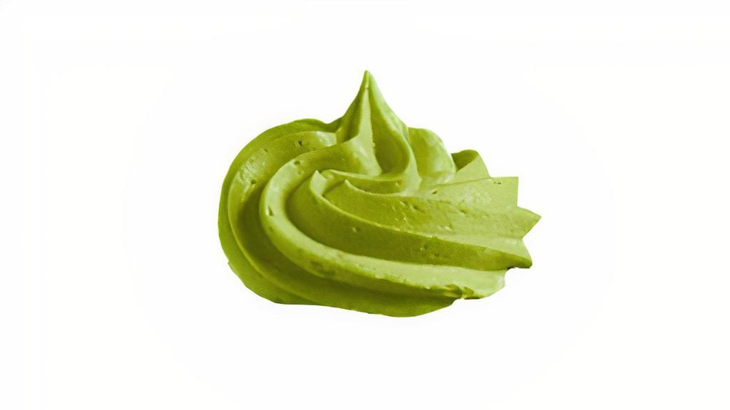 Matcha Whipped Cream · Homemade fluffy matcha whipped cream dip packed in plastic container for ugnuts.