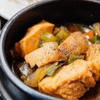 Ca Kho To · Salmon clay pot. Salmon in a caramelized soy sauce w/ onion, scallion, & bell peppers. Serve...