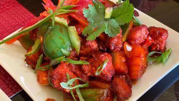 Chilli Chicken · A popular Indo-Chinese dish. Combination of onion, bell pepper, and crispy fried boneless ch...