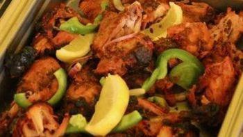 Tandoori Chicken · Chicken leg and thigh pieces are marinated overnight in yogurt with herbs and spices and coo...