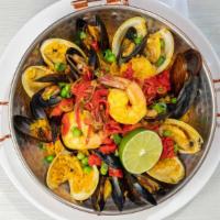 Paella Classic · Chicken, clams, mussels, shrimp, chorizo, Saffron Valencia rice