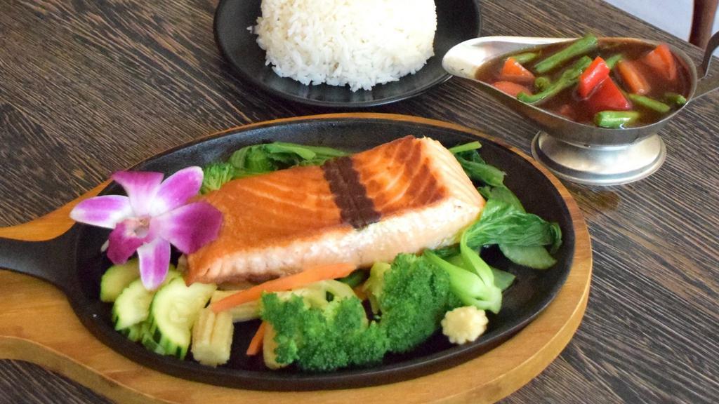 Spicy Basil Salmon · seared 8oz wild caught Norwegian salmon steak, steamed mixed vegetable, basil sauce served with jasmine rice