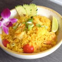Pineapple Fried Rice · aromatic stir fried jasmine rice with tumeric and curry powder, egg, tomato, onion, scallion...