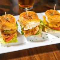 Classic Sliders · Three cheeseburger sliders cooked to your liking topped with lettuce, tomato, chipotle mayon...