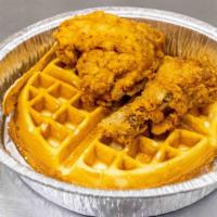 Chicken & Waffles · Belgian waffle and two pieces of fried chicken.