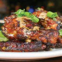 Grilled Jamaican Wings · Jumbo wings tossed in our homemade spicy jerk sauce. Served with celery sticks and Santa Fe ...