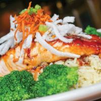 Hibachi Salmon · Norwegian salmon brushed with a teriyaki Asian glaze and topped with fried carrots, rice noo...