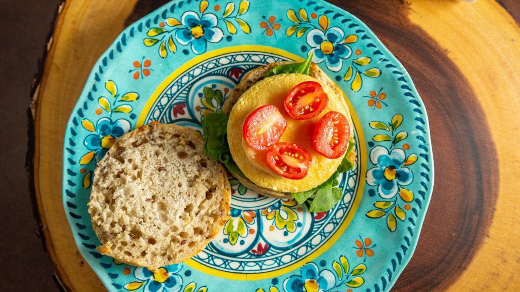 No Egg'N'Around - Vegan, Gf · Vegan, Gluten-Free Sandwich with 'JUST' egg substitution, spinach, and tomato, on a Gluten-Free English Muffin
