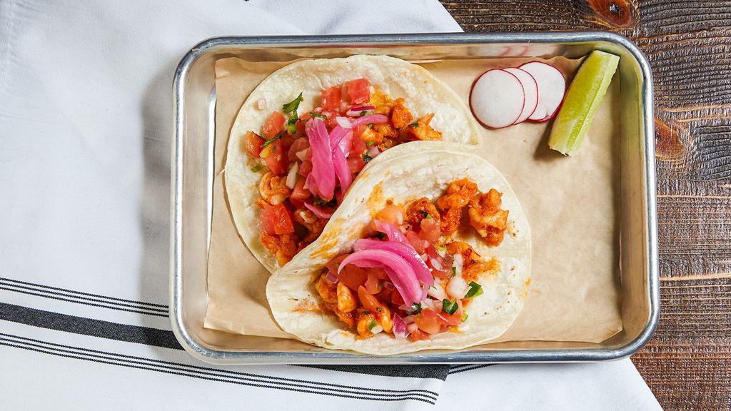 Shrimp · Shrimp marinated in lime juice with pico de gallo garnished with pickled onions.