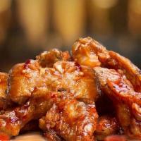 Buffalo Wings  · Wings tossed with buffalo wings sauce served with your choice of blue cheese or ranch.