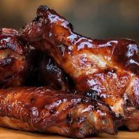 Bourbon Style Wings · Wings tossed with Bourbon wings sauce served with your choice of blue cheese or ranch.