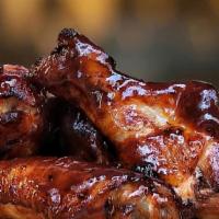 Classic Bbq Wings · Wings tossed with Classic BBQ sauce served with your choice of blue cheese or ranch.