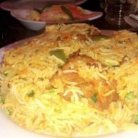 Fish Biryani (Tilapia Filet) · Tilapia fillet cooked with basmati rice, spices, and herbs.