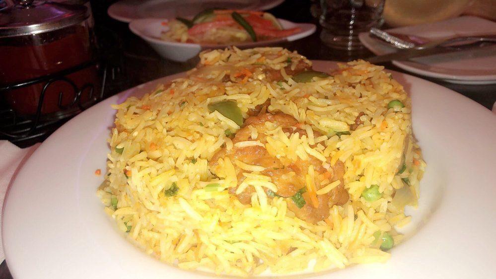Fish Biryani (Tilapia Filet) · Tilapia fillet cooked with basmati rice, spices, and herbs.
