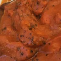 Butter Chicken · Dark meat chicken simmered in a tomato and onion sauce.