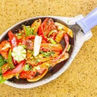 Tandoori Mixed Grill With Naan · Assortment of tandoori chicken, chicken tikka, lamb seekh kebab, fish tikka, and jumbo shrimp.