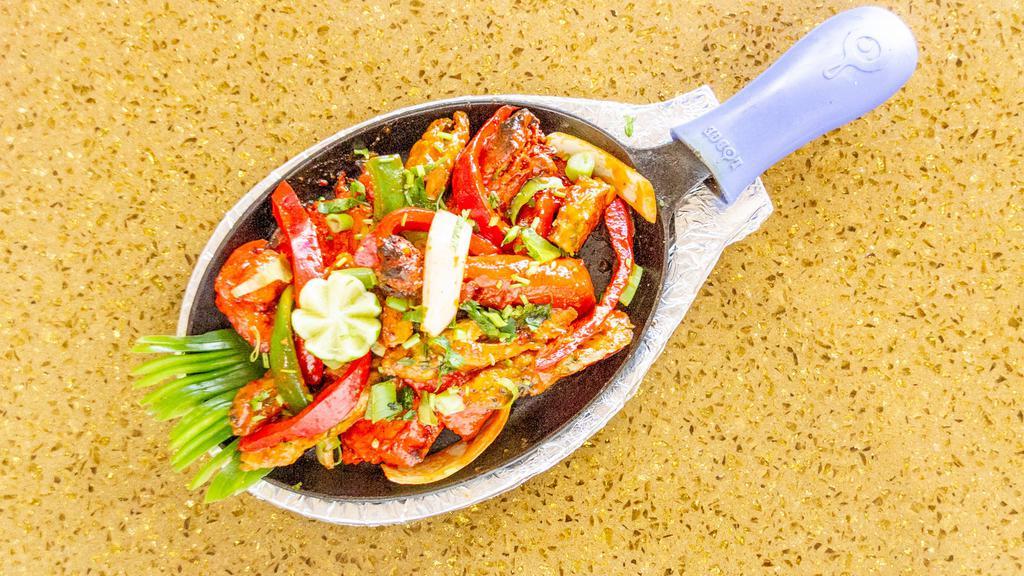Tandoori Mixed Grill With Naan · Assortment of tandoori chicken, chicken tikka, lamb seekh kebab, fish tikka, and jumbo shrimp.