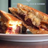 Russian Panini · Hot sandwich with roast beef, Muenster cheese, caramelized onions, lettuce, plum tomatoes an...