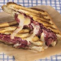 The Combo Panini · Hot sandwich with pastrami, corned beef, provolone cheese, lettuce, tomatoes, mustard and ho...