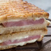 The Alpino Panini · Hot grilled sandwich with Black Forest ham, Alpine Swiss cheese, grilled vegetables and lemo...