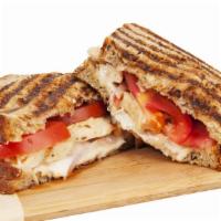 Tuscan Panini · Hot sandwich with fresh mozzarella, plum tomatoes, basil, spinach and sun dried tomatoes. Se...