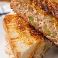 Tuna Melt Panini · Hot sandwich with fresh tuna salad, cheddar cheese, lettuce and plum tomatoes. Served on Eur...