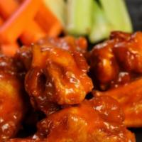 Classic Buffalo Wings · 8 pieces of classic buffalo wing (medium heat), served with carrots and celery and a choice ...