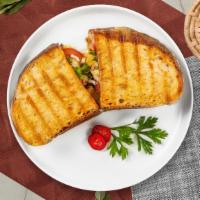 Seal The Grill Chicken Panini · Grilled chicken, fresh mozzarella, arugula, sundried tomato paste, and fresh basil on toaste...