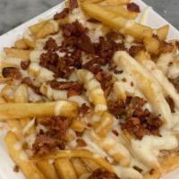 Loaded French Fries · French fries smothered in mozzarella cheese topped with bacon bits.
