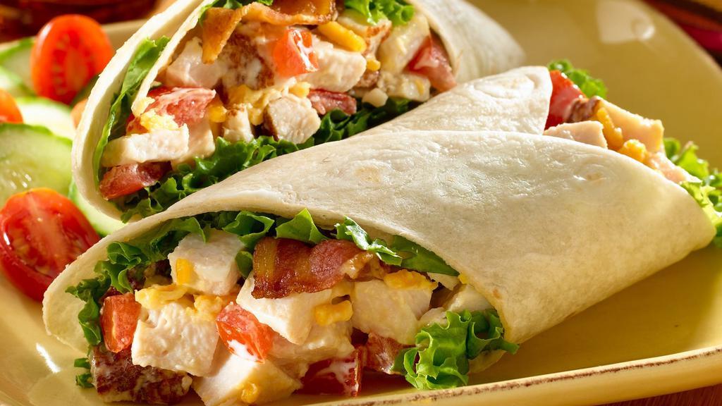 Grilled Chicken Caesar Wrap · Signature Wrap With Grilled Chicken , Romaine Lettuce , Parmesan Cheese and Caesar Dressing