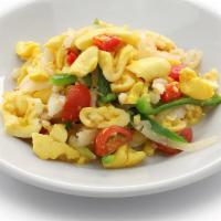 Ackee & Saltfish · Ackee and saltfish is the signature breakfast of Jamaica. It goes great with our golden frie...