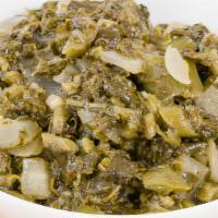 Calalloo & Salt Fish · Bite size pieces of trim goat meat, stewed and seasoned with the all famous curry powder. If...