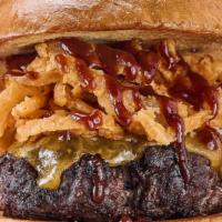 Cowboy Burger  · Angus beef meat , cheddar cheese , spicy bbq sauce , fried onion strings; Brioche bun