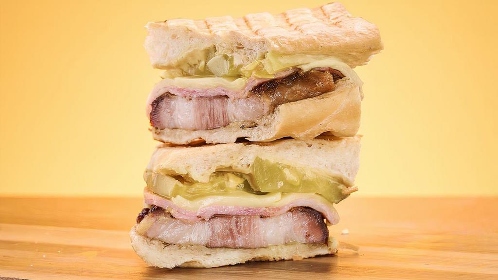 Cubano Sandwich · Roast pork, ham, Swiss cheese, pickle, mustard.