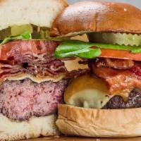 Monster Bacon Burger  · Black angus meat , bacon , more bacon , lettuce , tomatoes , pickles , grilled onions 
brioc...