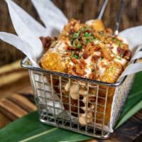 Crack Tots · Crispy tater tots with our crack sauce, bacon crumble and chives.