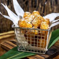 Parmesan Truffle Tots · Crispy tater tots with freshly grated Parmesan cheese, white truffle oil and chives.