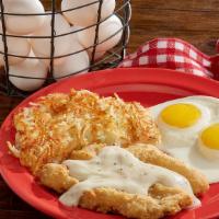 Country Fried Steak And Eggs · Breaded, seasoned beef steak smothered in country gravy. Served with two eggs any style, sea...