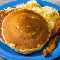 Cakes, Eggs And Bacon Pancake · Two of the best pancakes in town, two farm-fresh eggs any style, and two strips of applewood...