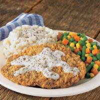 Country Fried Steak · Select beef steak, lightly breaded and seasoned, fried until golden, and ladled with our cou...