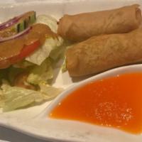 Original Spring Rolls · Vegetable spring rolls served with a carrot sauce.