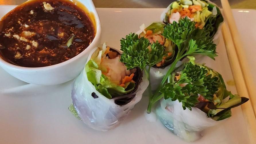 Shrimp Summer Roll · Fresh summer roll, shredded lettuce, mint and carrot combined with shrimp, wrapped in softened rice paper and served with peanut tamarind dipping sauce.