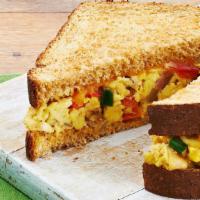 Western Egg Sandwich Or Wrap · Two Eggs Scrambled, American Cheese, Ham, Peppers & Onions.