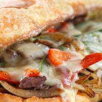 California Cheese Steak · Thinly Sliced Grilled Steak, Sautéed Mushroom, Onions, Peppers, Swiss & Cheddar Cheese. Serv...