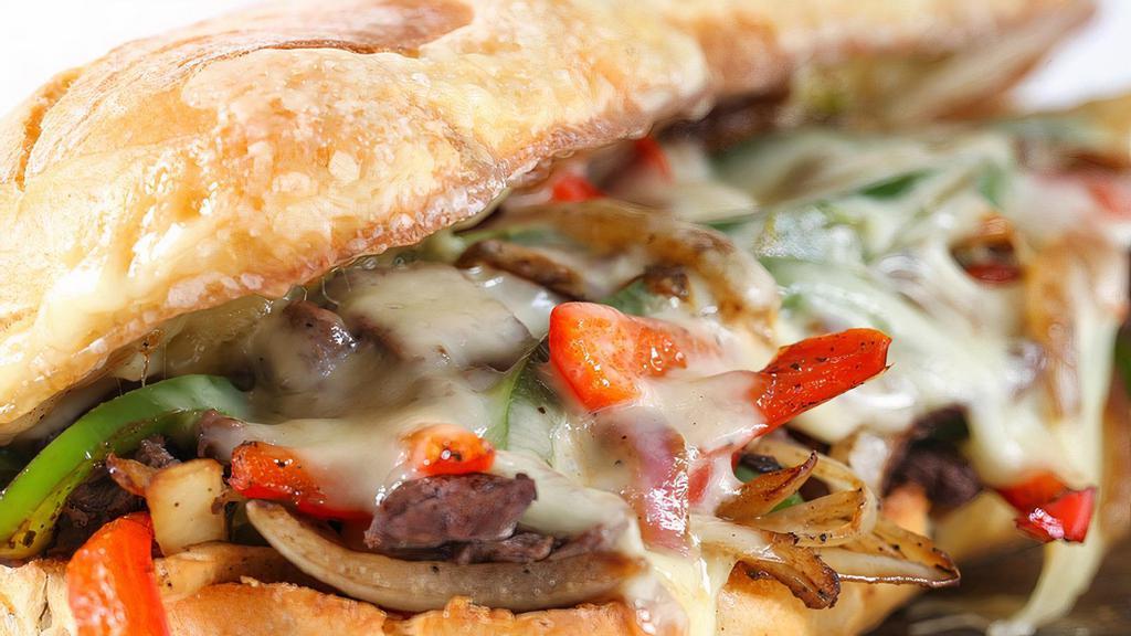 California Cheese Steak · Thinly Sliced Grilled Steak, Sautéed Mushroom, Onions, Peppers, Swiss & Cheddar Cheese. Served On A Toasted Semolina Roll.