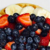 Red White & Blue Waffle · Fresh strawberries, banana and fresh blueberries.