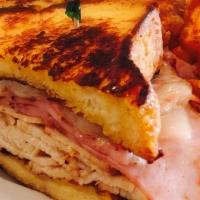Monte Cristo · French toast sandwich of sliced turkey, grilled ham and melted Swiss.